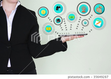 the girl is holding a tablet tablet. the girl is holding a tablet tablet. 35649287