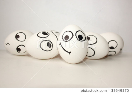 smiling funny eggs with a face on a white smiling funny eggs with a face on a white 35649370