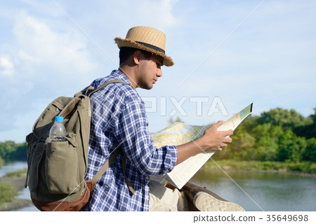 Young Asian tourist man with backpack Young Asian tourist man with backpack 35649698