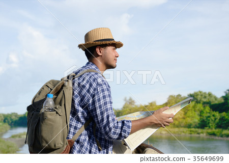 Young Asian tourist man with backpack Young Asian tourist man with backpack 35649699