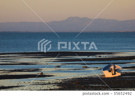 Fishing boat at sunset in the bay of the San 35652492