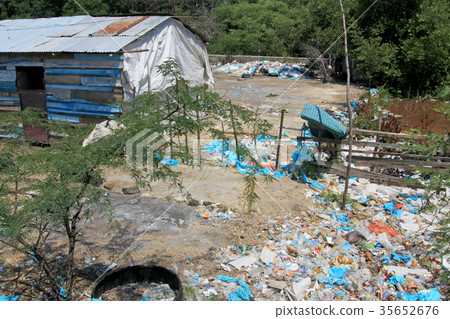 Littering of garbage in front of private houses 35652676