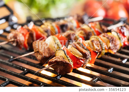 Grilling shashlik on barbecue grill Grilling shashlik on barbecue grill 35654123