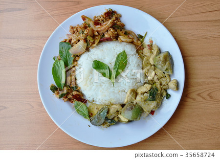 chicken in green curry and spicy minced pork salad chicken in green curry and spicy minced pork salad 35658724