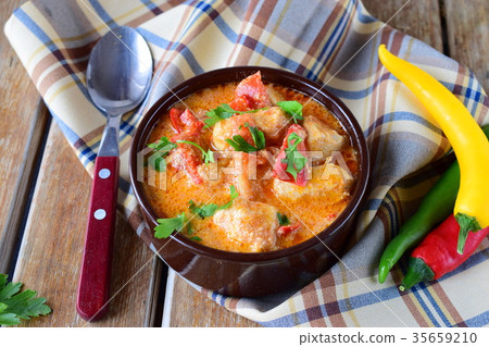 Hungarian dish with paprika and chicken, sauce 35659210
