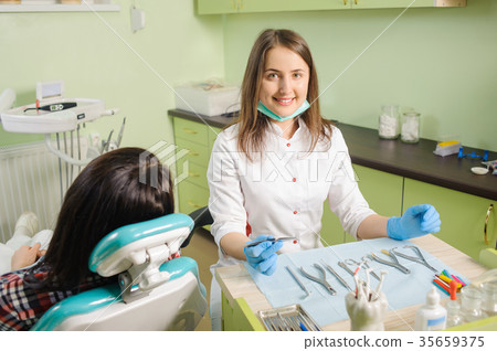 Female dentist working at dental clinic with female patien Female dentist working at dental clinic with female patien 35659375