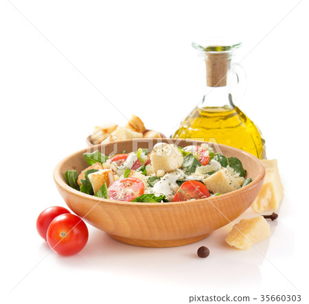 caesar salad in plate on white background 35660303