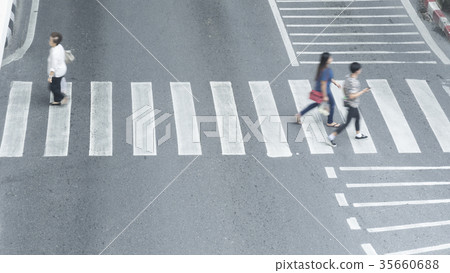 blur people walk fast across the sign of crossroad 35660688