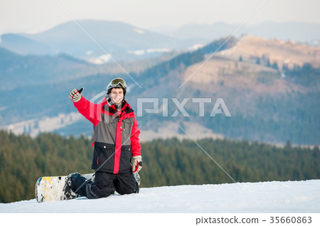Male boarder on his snowboard at winer resort 35660863