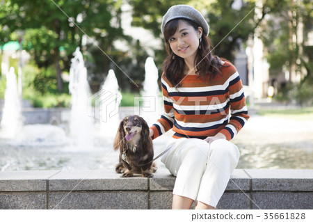 Woman walking park with pet Woman walking park with pet 35661828
