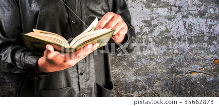 Koran in hand - holy book of Muslims  35662873