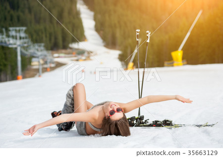 Sexy woman skier on snowy slope at ski resort Sexy woman skier on snowy slope at ski resort 35663129