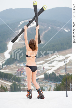 Sexy female skier on snowy slope at ski resort Sexy female skier on snowy slope at ski resort 35663474