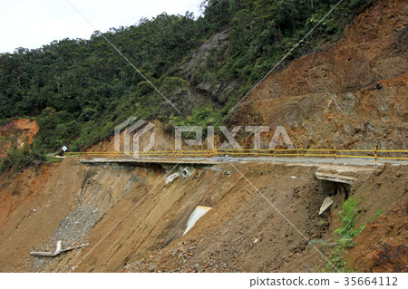 Destroyed road landslide damaged of powerful flood 35664112