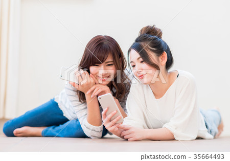 A young lady (a smartphone) A young lady (a smartphone) 35664493
