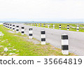 white and black pole barrier and curve road 35664819