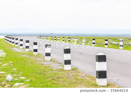 white and black pole barrier and curve road white and black pole barrier and curve road 35664819