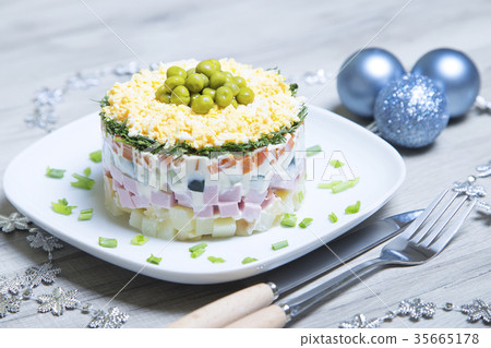 Traditional Russian salad olivier on a white plate 35665178