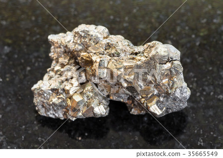 rough pyrite stone on dark background rough pyrite stone on dark background 35665549