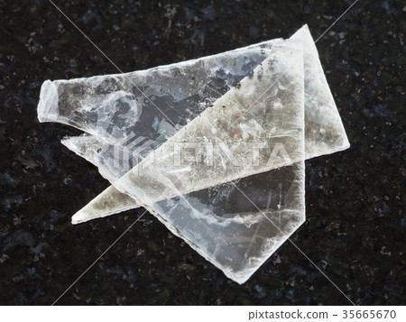 raw muscovite mica lamina on dark background 35665670