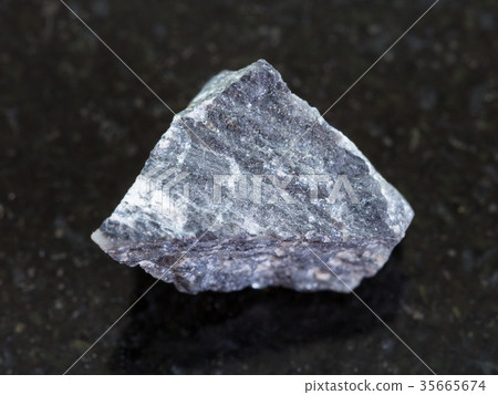 raw stibnite (antimonite) ore on dark 35665674