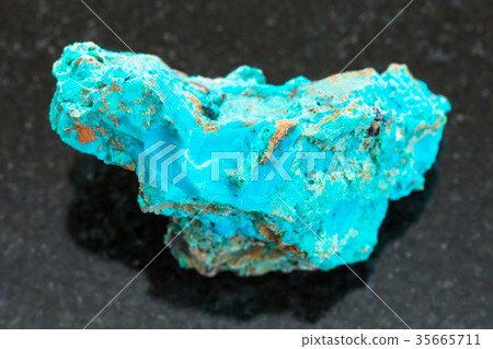 raw Chrysocolla stone on dark background 35665711
