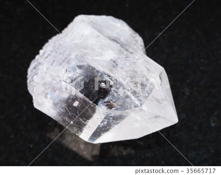 raw rock-crystal of quartz gemstone on dark raw rock-crystal of quartz gemstone on dark 35665717