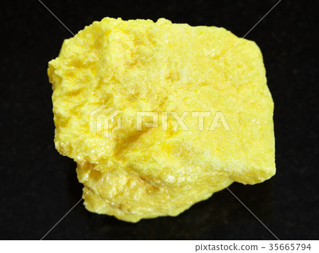 rough native Sulphur stone on dark background 35665794