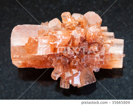 rough crystal of Aragonite gemstone on dark 35665809