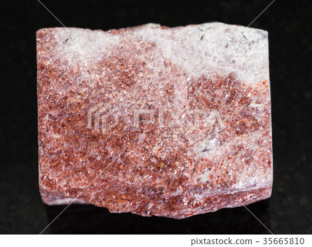 rough pink Aventurine stone on dark background 35665810