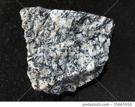 rough lujavrite stone on dark background 35665958
