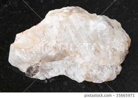 rough belomorite stone on dark background 35665971