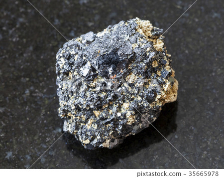 rough Perovskite stone on dark background rough Perovskite stone on dark background 35665978