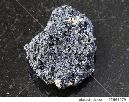 Perovskite stone on dark background 35665979