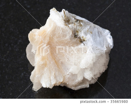 rough Thomsonite stone on dark background 35665980