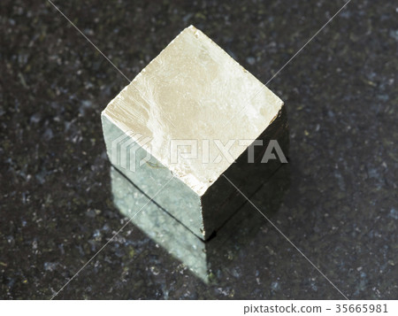 raw pyrite crystal on dark background 35665981