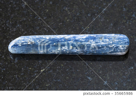 tumbled Kyanite crystal gemstone on dark tumbled Kyanite crystal gemstone on dark 35665986
