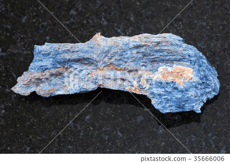 raw Rhodusite stone on dark background 35666006