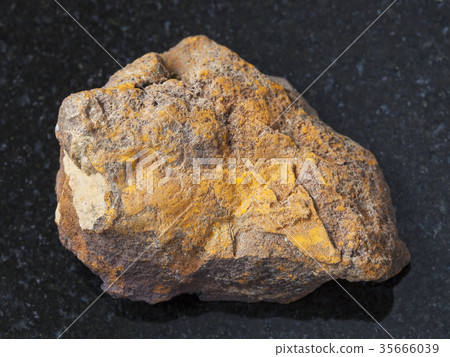 raw limonite stone on dark background raw limonite stone on dark background 35666039