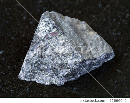 rough antimonite stone on dark background 35666041