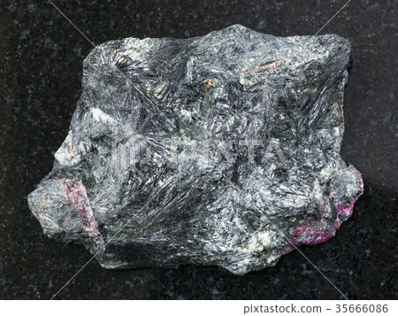 rough aegirine stone on dark background 35666086