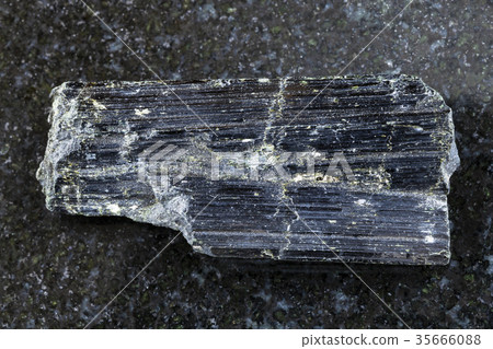 rough aegirine crystals on dark background 35666088