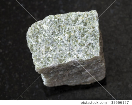 rough quartz-mica schist stone on dark background rough quartz-mica schist stone on dark background 35666157