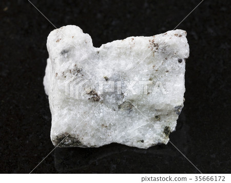 raw carbonatite stone on dark background 35666172