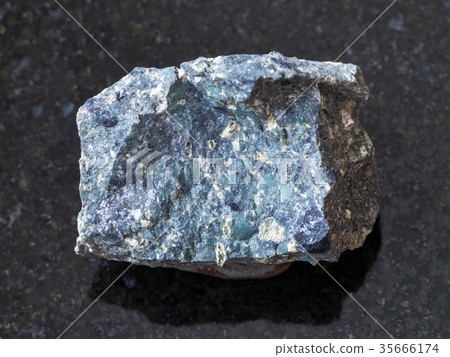 rough Kimberlite stone on dark background rough Kimberlite stone on dark background 35666174