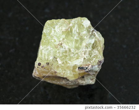 rough crystal of Saamite (fluorapatite) on dark 35666232