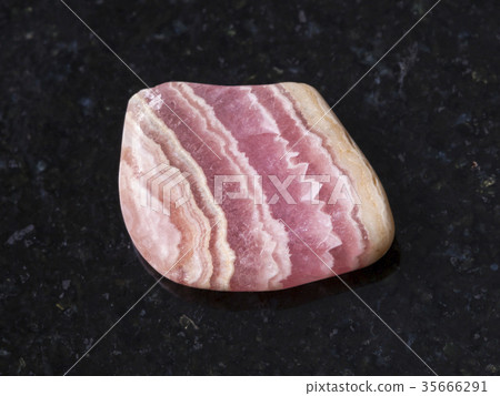polished rhodochrosite gem stone on dark polished rhodochrosite gem stone on dark 35666291