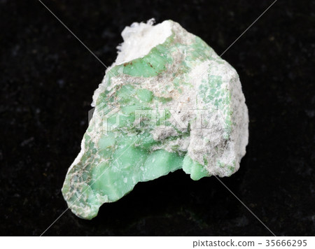 rough Variscite stone on dark background rough Variscite stone on dark background 35666295