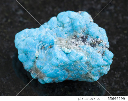 raw blue Turquoise gemstone on dark background raw blue Turquoise gemstone on dark background 35666299