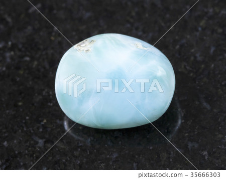 tumbled Larimar gemstone on dark background tumbled Larimar gemstone on dark background 35666303
